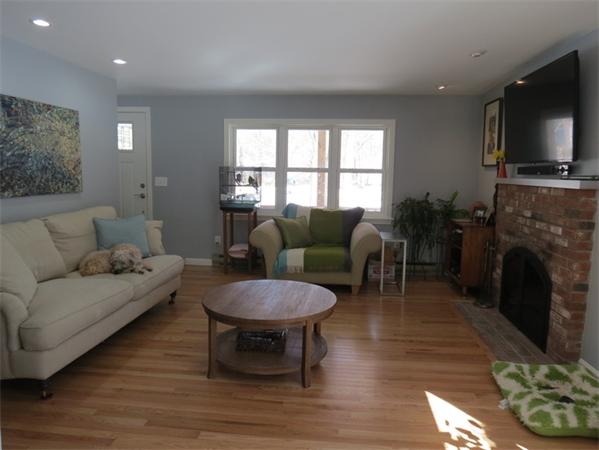 32 Baird Centerville, MA 02632 - Photo 7 of 14 a living room with furniture a fireplace and a flat screen tv