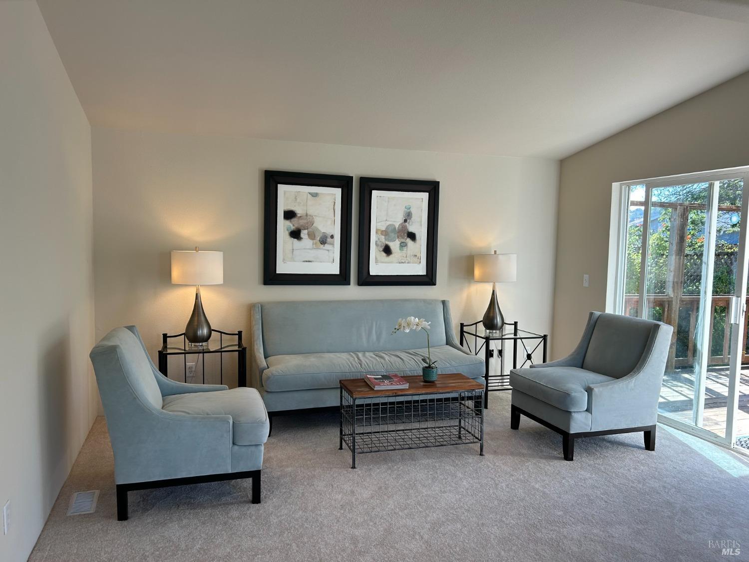 9 Yosemite Road San Rafael, CA 94903 - Photo 1 of 1 a living room with furniture and a lamp