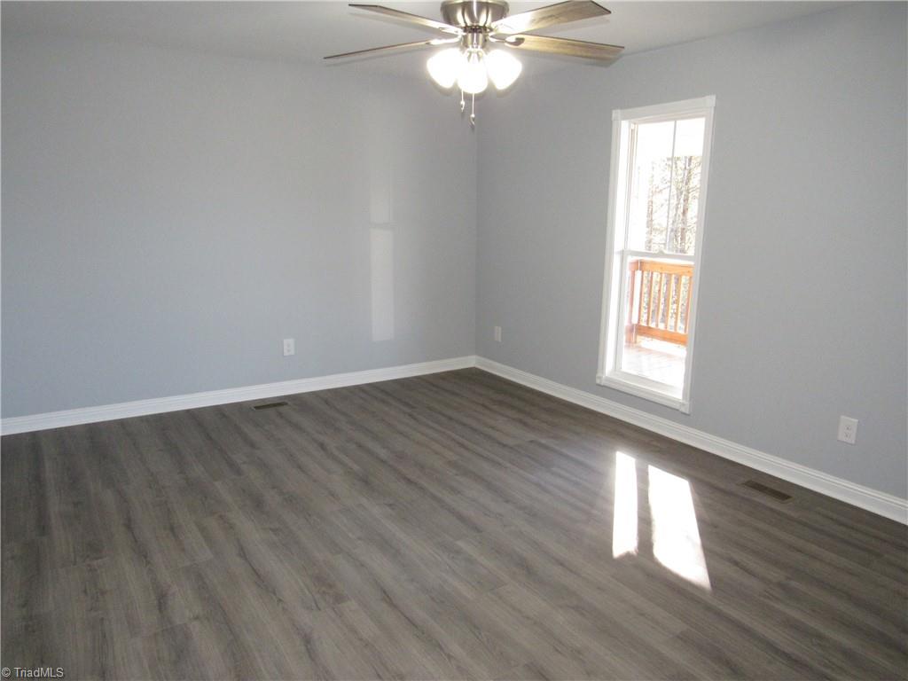 4060 Sowers Road Linwood, NC 27299 - Photo 13 of 28 Spacious dining area with a ceiling fan