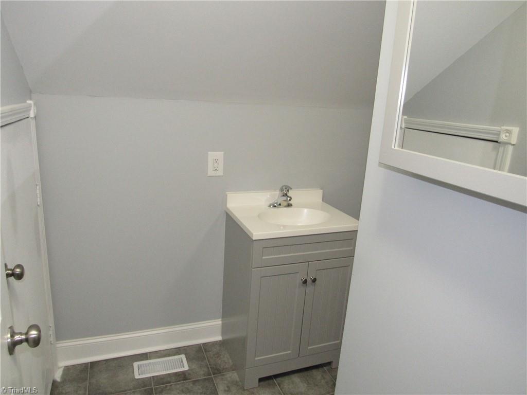 4060 Sowers Road Linwood, NC 27299 - Photo 25 of 28 Upper level bath with a tub shower combination