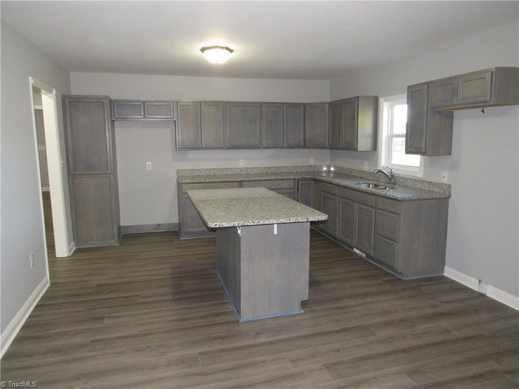 4060 Sowers Road Linwood, NC 27299 - Photo 9 of 28 Spacious kitchen with good cabinet and counter space.....granite counters