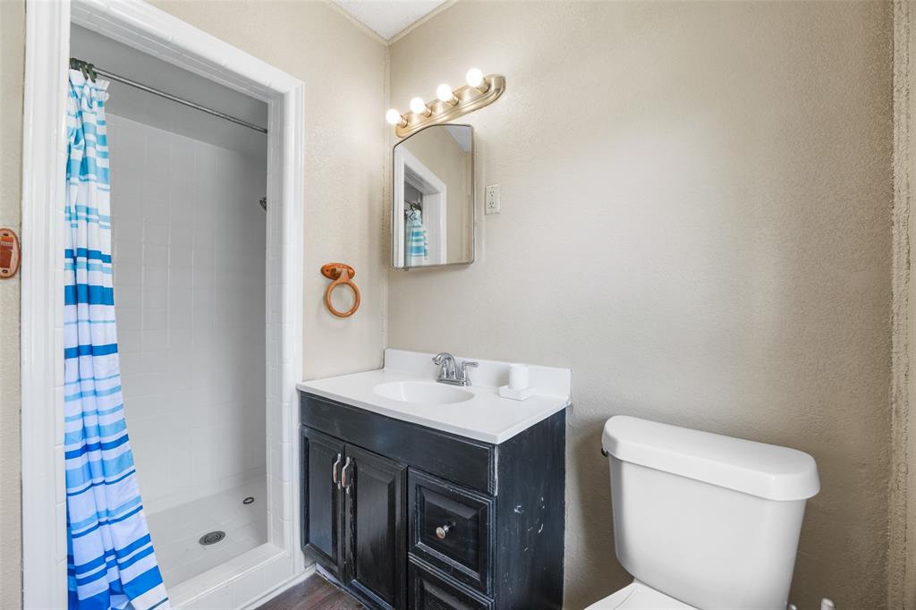 1145 Jefferson Road Paris, TX 75460 - Photo 12 of 17 a bathroom with a sink and a toilet