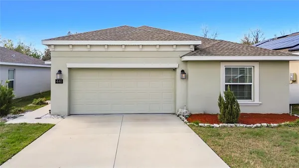 a front view of a house with a garage