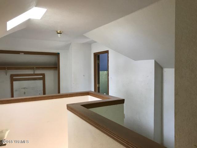 7711 Branch Road Harrah, WA 98933 - Photo 22 of 27 a view of a hallway with a fireplace