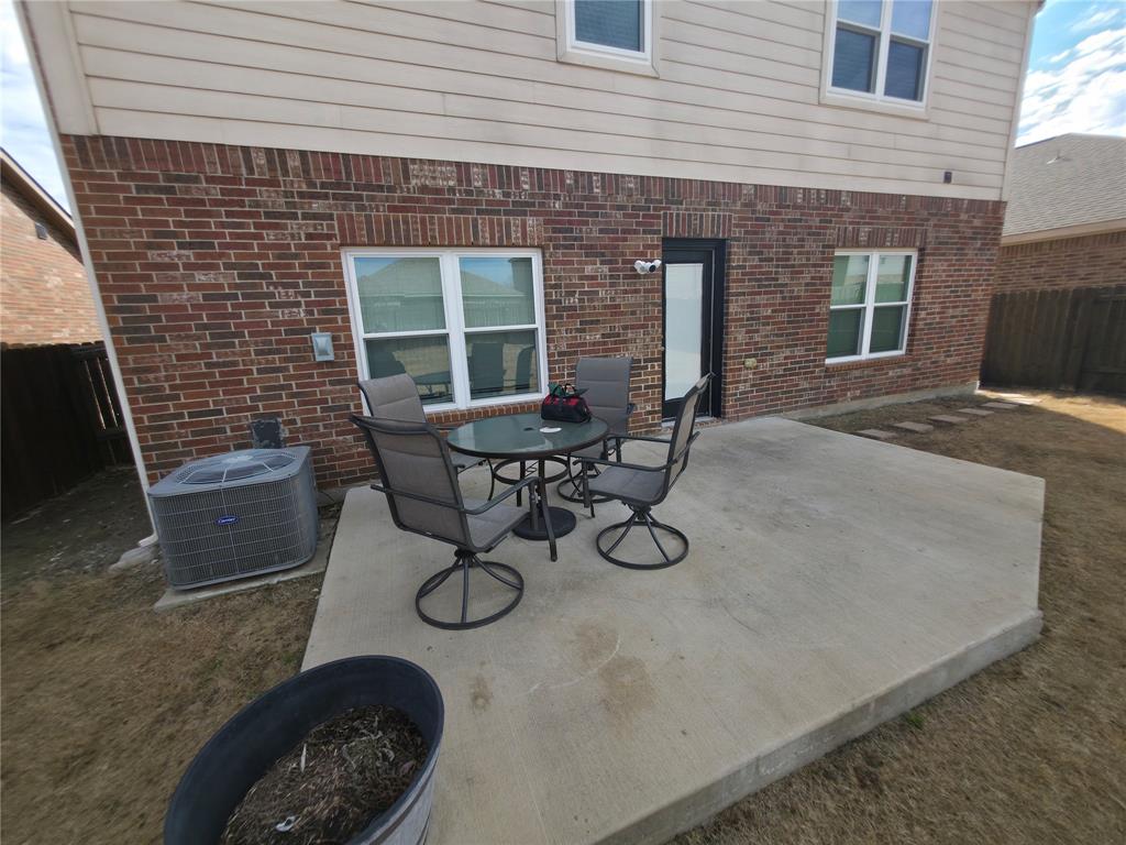 149 Ryan Street Anna, TX 75409 - Photo 32 of 38 a view of a backyard with table and chairs