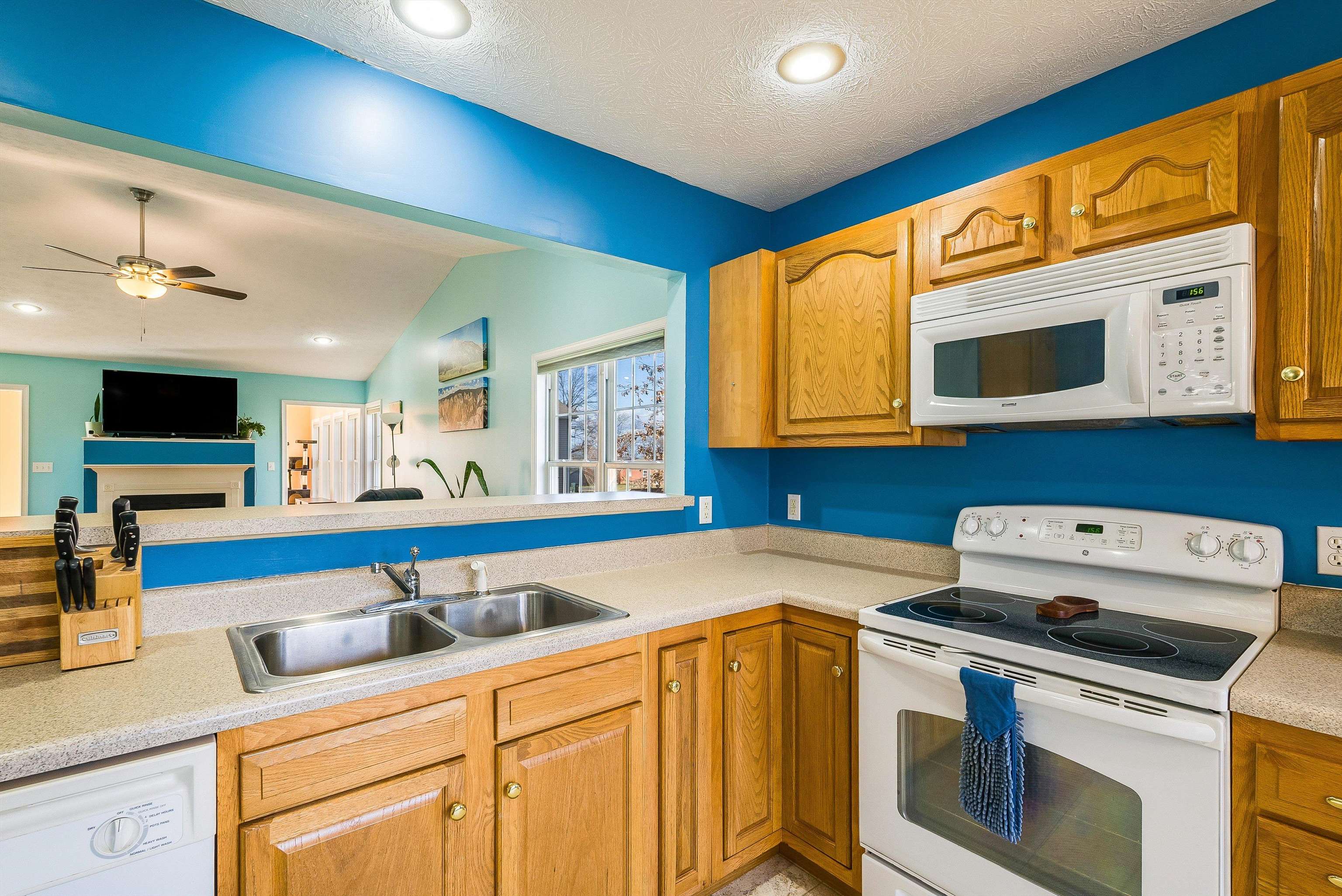 425 South Jackson Avenue Waynesboro, VA 22980 - Photo 15 of 47 a kitchen with stainless steel appliances granite countertop a sink a stove and a microwave