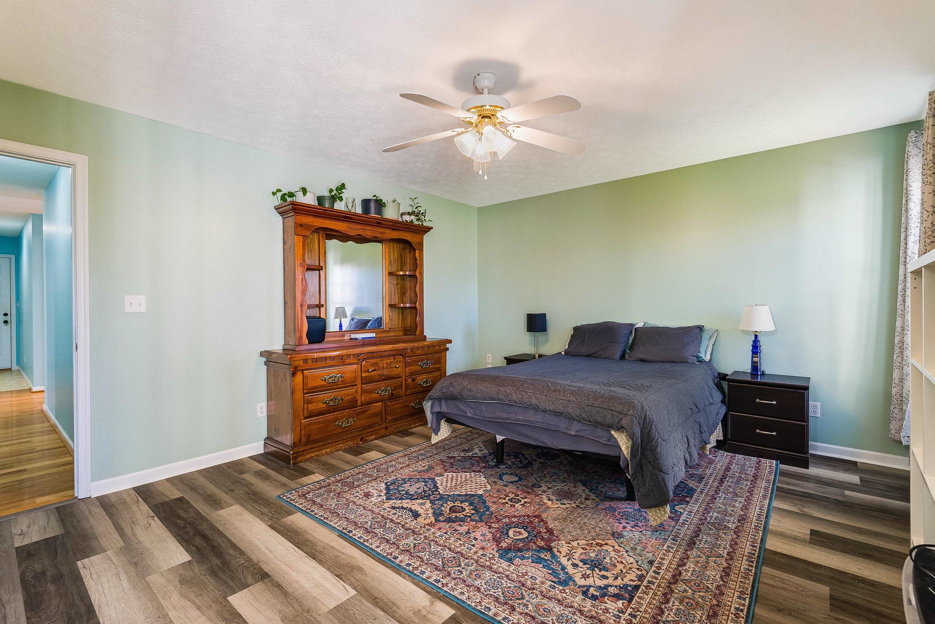 425 South Jackson Avenue Waynesboro, VA 22980 - Photo 26 of 47 a bedroom with a bed and a chandelier