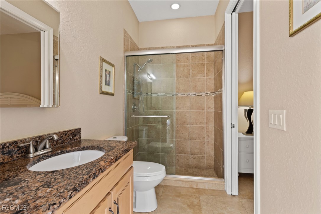 6057 Calusa Rdg Trail Bokeelia, FL 33922 - Photo 22 of 45 a bathroom with a sink and a mirror