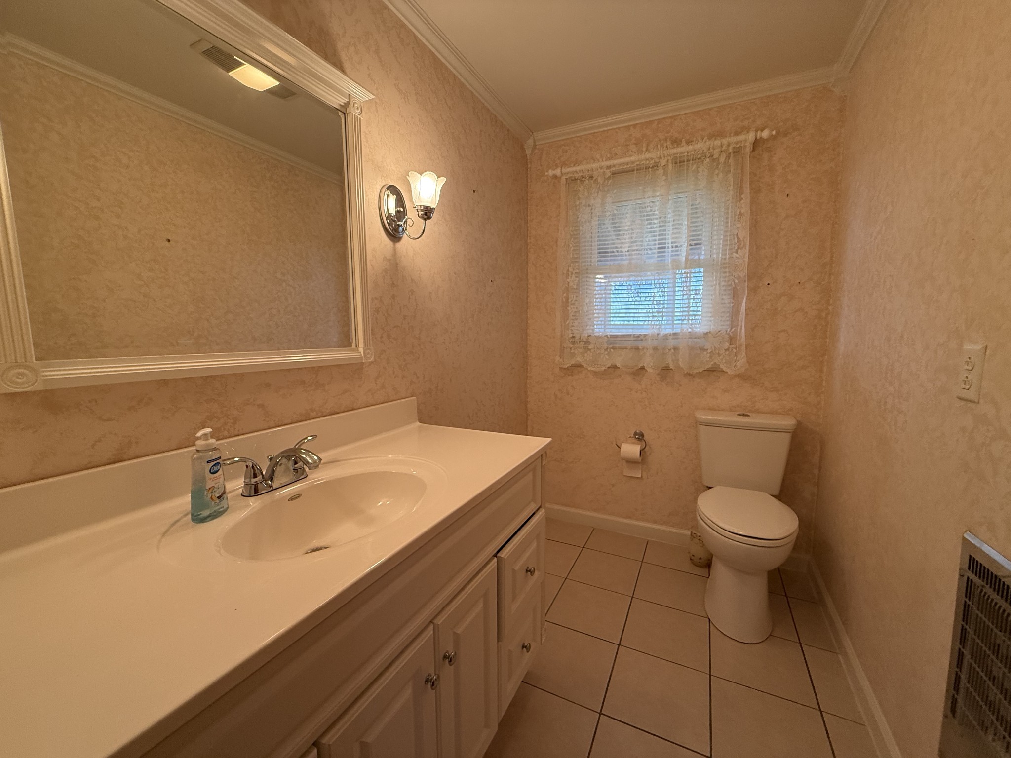 2971 Monroe Floyd Road Decherd, TN 37324 - Photo 18 of 26 a bathroom with a sink a toilet and mirror