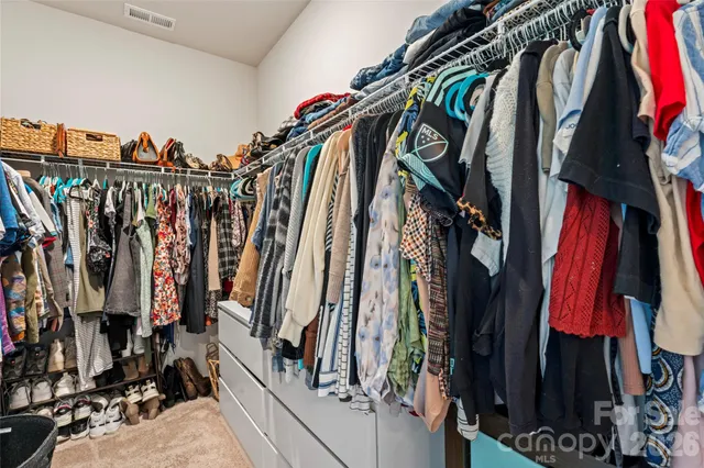 a view of a house with backyard porch and sitting area
