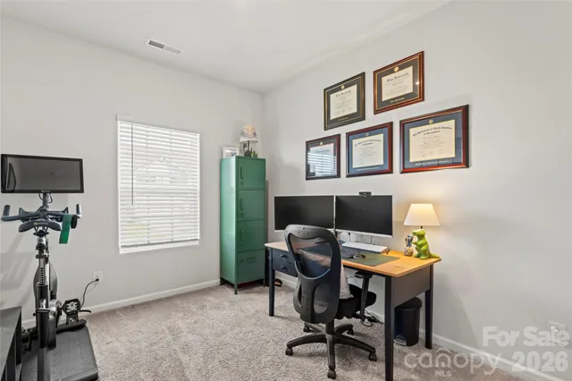 a view of swimming pool with a patio and a yard