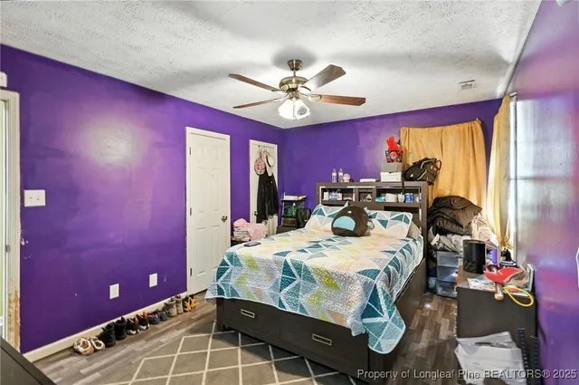 a bed room with a bed and a chandelier