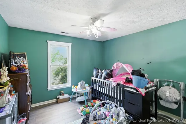 a bedroom with furniture and a window