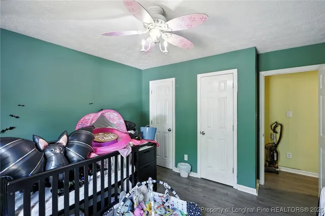 a bedroom with furniture and a chandelier
