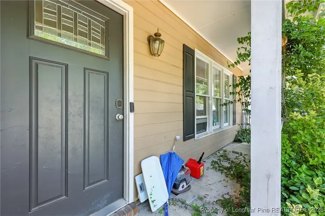 a view of a door and chair in front of a door