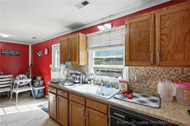 a bathroom with a granite countertop sink and a large mirror