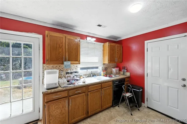 a bathroom with a sink and a window