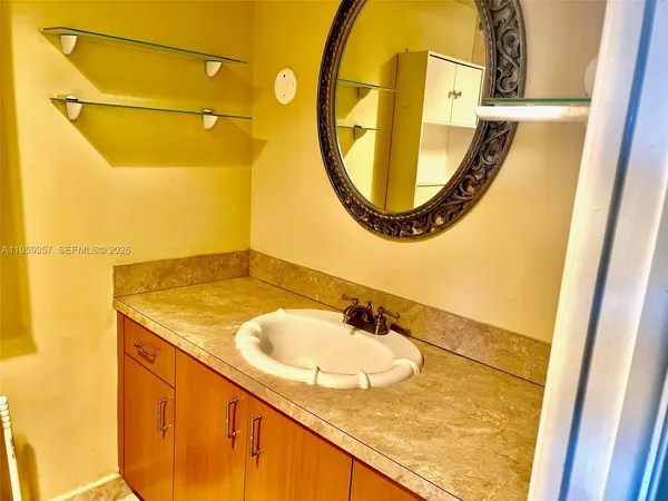 a bathroom with a sink and a mirror