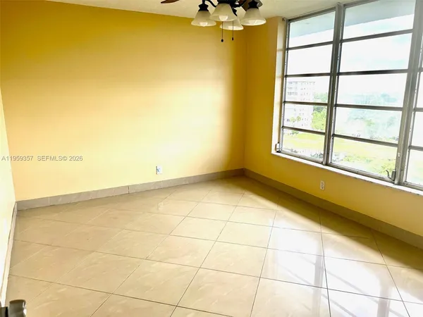 a view of an empty room with a window