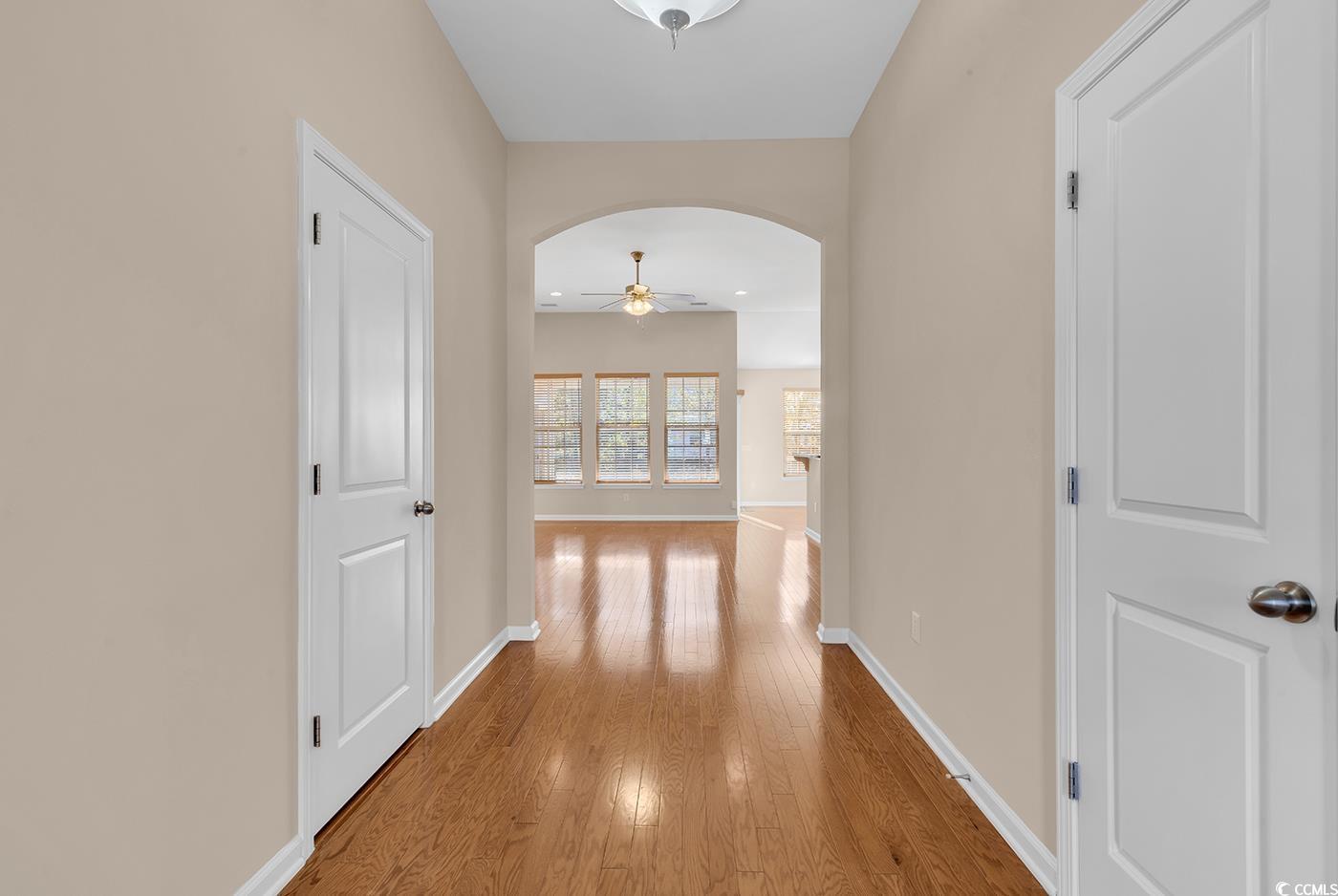 1612 Fairforest Court Conway, SC 29526 - Photo 3 of 40 Hallway featuring arched walkways, light wood-style floors, and recessed lighting