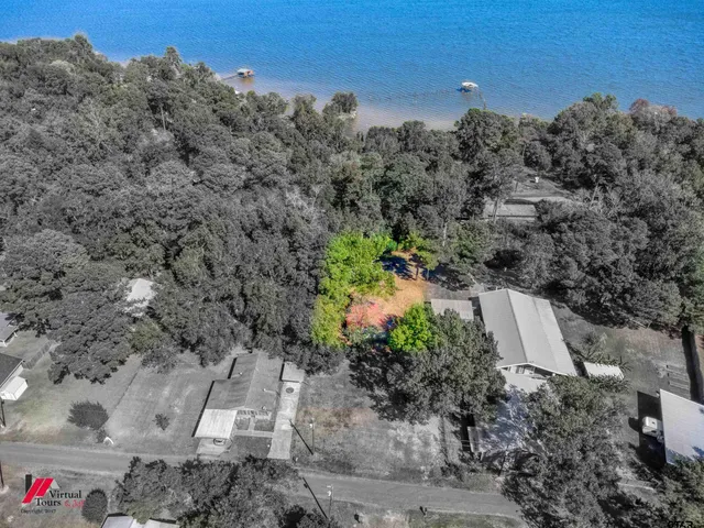 an aerial view of a house with a yard
