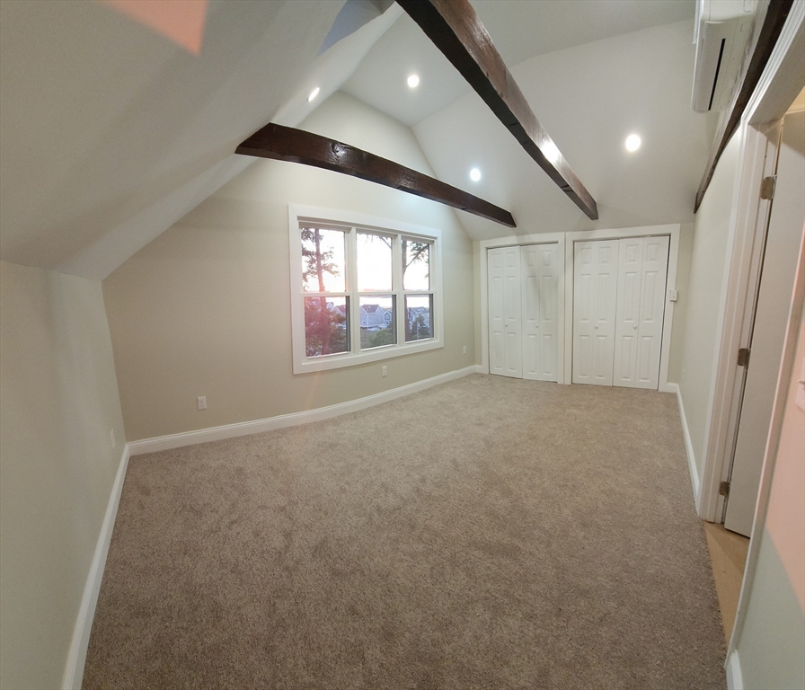 41 Pecksuot Road Weymouth, MA 02191 - Photo 15 of 22 an empty room with windows and fireplace