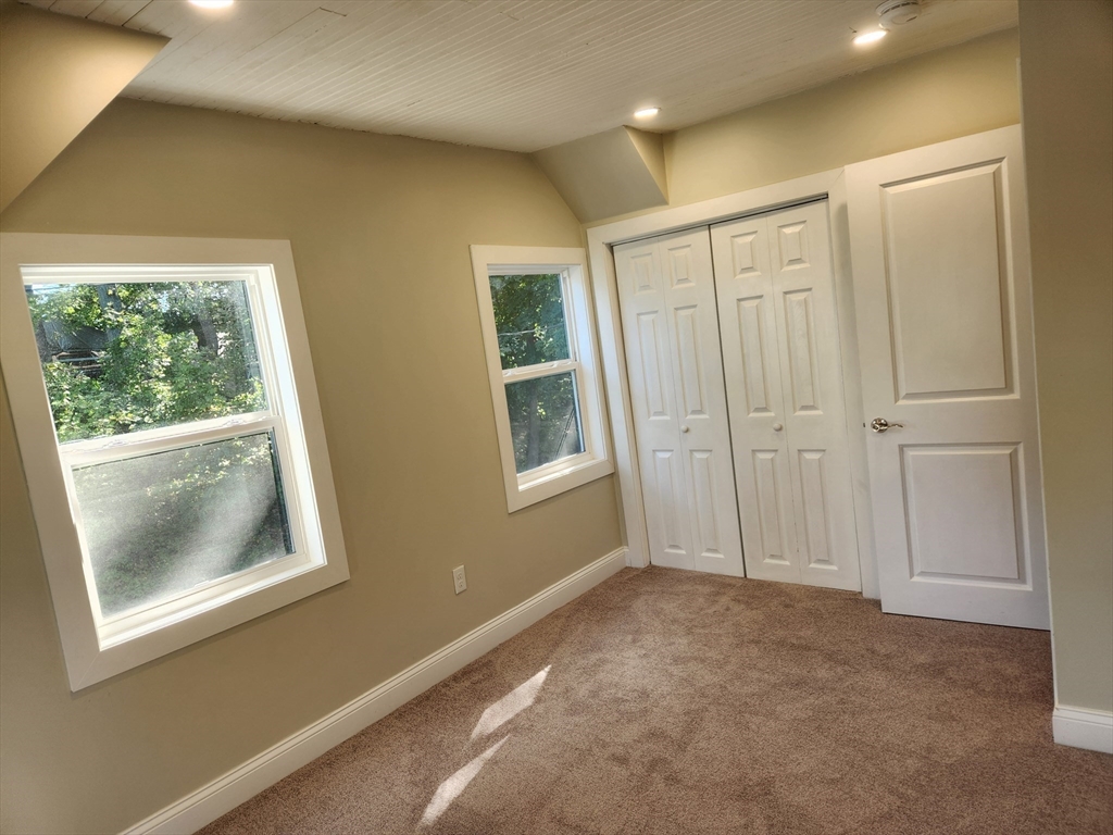 41 Pecksuot Road Weymouth, MA 02191 - Photo 17 of 22 a view of an empty room with window and closet area