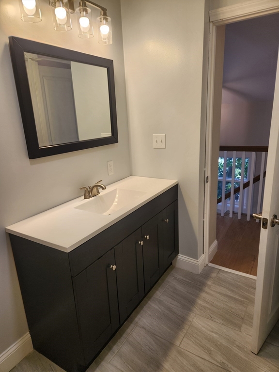 41 Pecksuot Road Weymouth, MA 02191 - Photo 18 of 22 a bathroom with a sink vanity and mirror