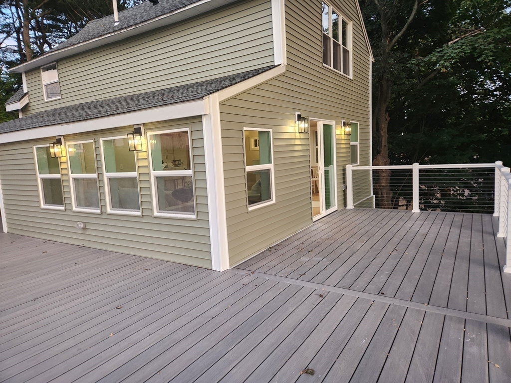41 Pecksuot Road Weymouth, MA 02191 - Photo 20 of 22 a deck view with a wooden floor