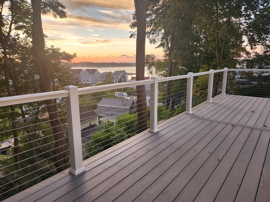 41 Pecksuot Road Weymouth, MA 02191 - Photo 2 of 22 a view of a balcony with wooden floor
