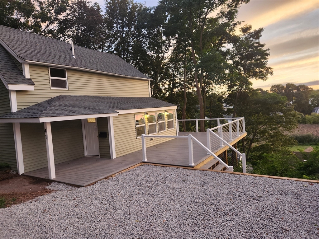 41 Pecksuot Road Weymouth, MA 02191 - Photo 4 of 22 a house with trees in the background
