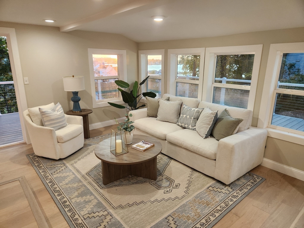 41 Pecksuot Road Weymouth, MA 02191 - Photo 8 of 22 a living room with furniture and a large window