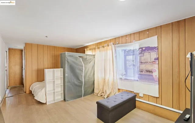 a bedroom with a bed and dresser