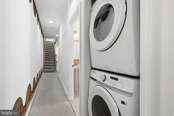 a view of a hallway with washer and dryer