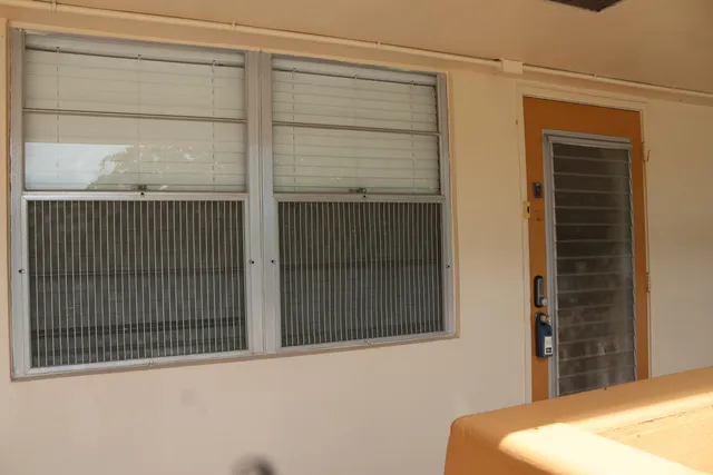 a view of a door and a window