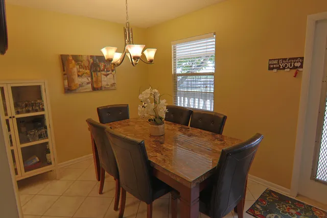 a view of a dining room with furniture and a window