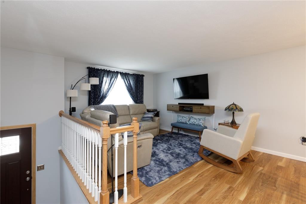 181 Partridge Run Road Gibsonia, PA 15044 - Photo 2 of 34 a living room with furniture and a flat screen tv