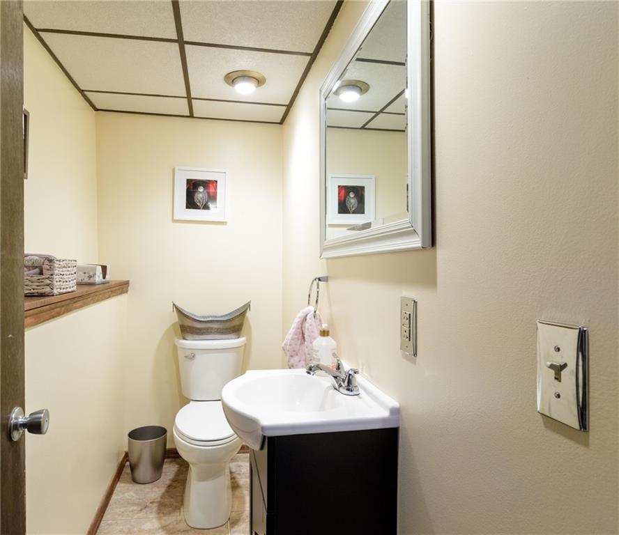 181 Partridge Run Road Gibsonia, PA 15044 - Photo 21 of 34 a bathroom with a toilet sink and mirror