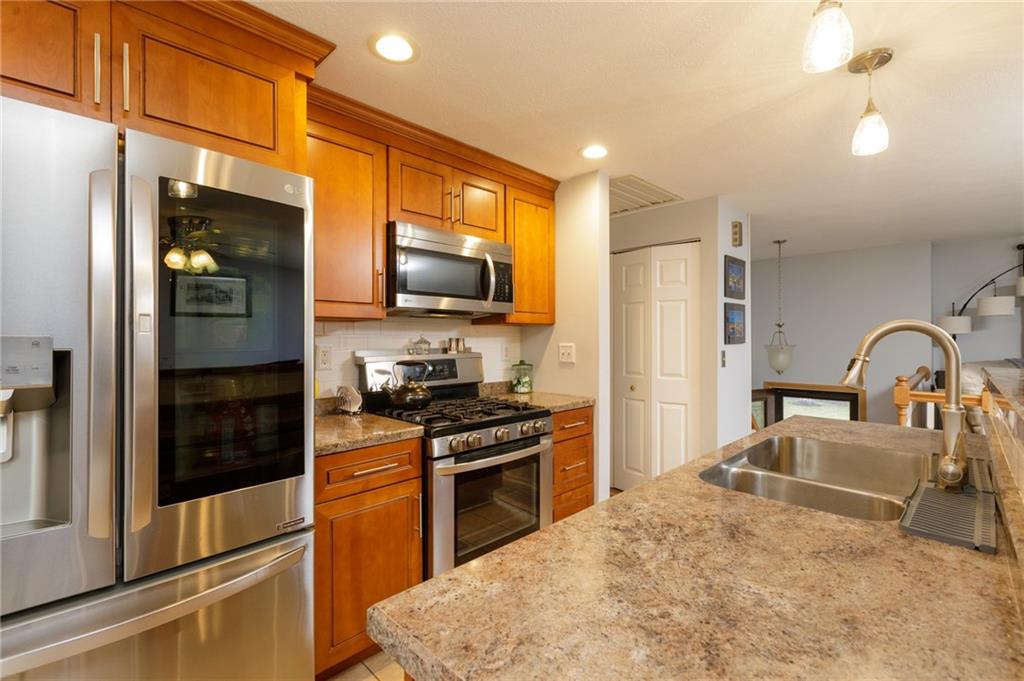 181 Partridge Run Road Gibsonia, PA 15044 - Photo 6 of 34 a kitchen with stainless steel appliances granite countertop a refrigerator a stove top oven a sink and dishwasher