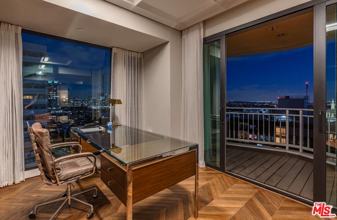 10727 Wilshire Boulevard, Unit 1805 Los Angeles, CA 90024 - Photo 30 of 34 a living room with furniture