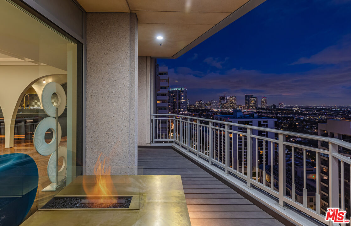 10727 Wilshire Boulevard, Unit 1805 Los Angeles, CA 90024 - Photo 32 of 34 a view of roof deck with wooden floor and a potted plant