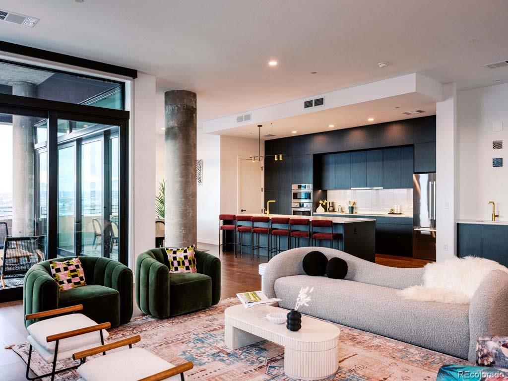 3520 Chestnut Place, Unit PH1201 Denver, CO 80216 - Photo 1 of 44 a living room with furniture and a large window