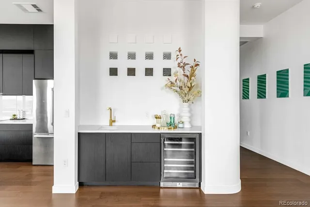 a kitchen with a sink and a refrigerator
