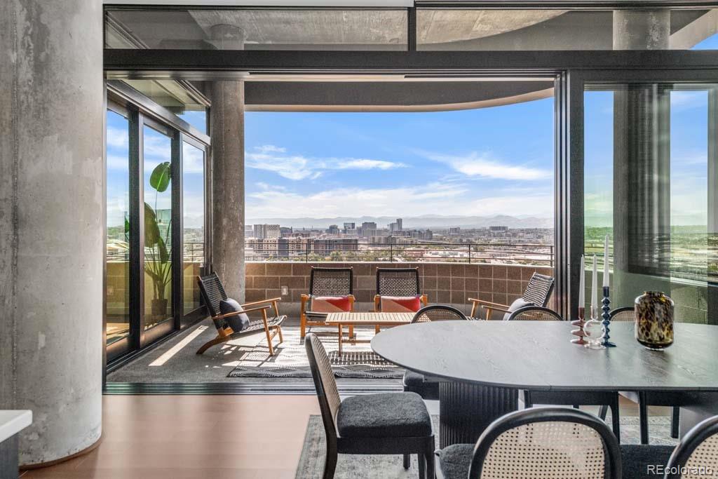 3520 Chestnut Place, Unit PH1201 Denver, CO 80216 - Photo 14 of 44 a view of a dining room with furniture window and outside view