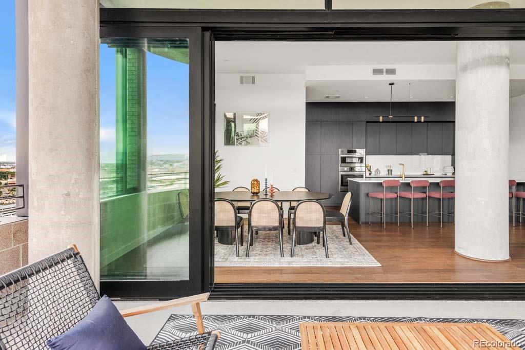 3520 Chestnut Place, Unit PH1201 Denver, CO 80216 - Photo 16 of 44 a living room with furniture