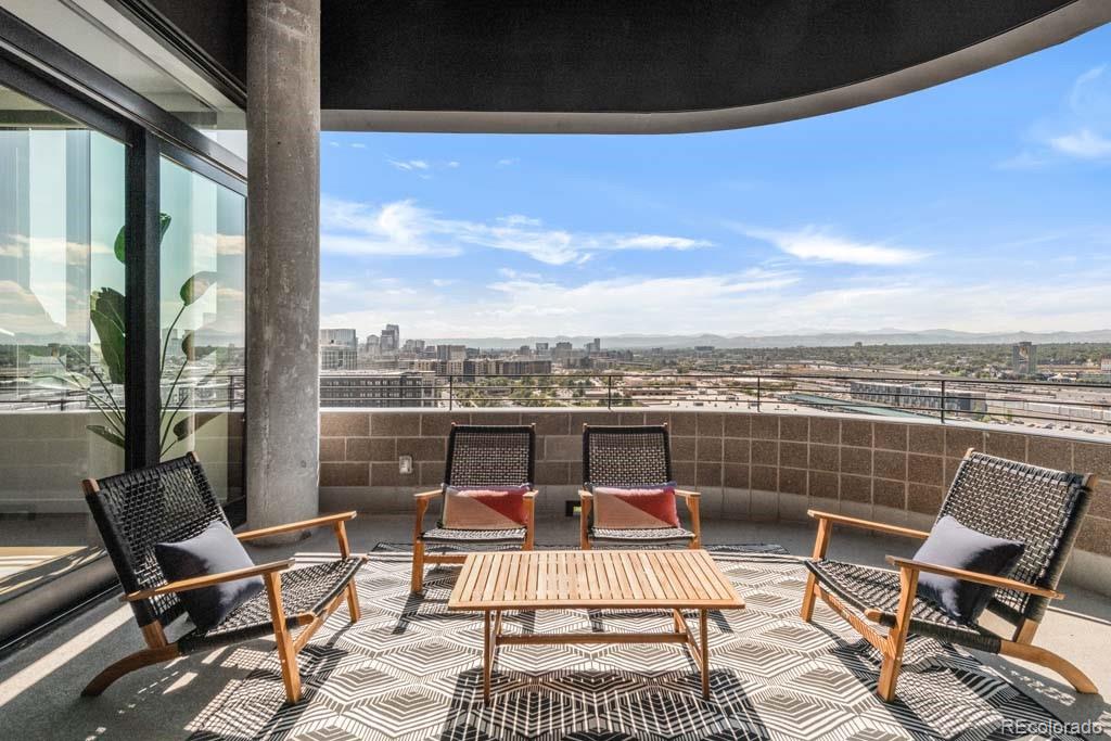 3520 Chestnut Place, Unit PH1201 Denver, CO 80216 - Photo 18 of 44 a view of a roof deck with furniture