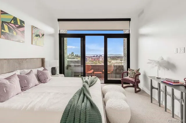a view of a balcony with chair and glass door
