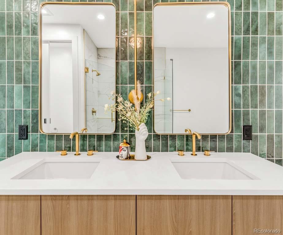 3520 Chestnut Place, Unit PH1201 Denver, CO 80216 - Photo 24 of 44 a bathroom with a sink and a mirror