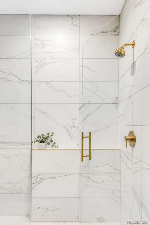 3520 Chestnut Place, Unit PH1201 Denver, CO 80216 - Photo 25 of 44 a bathroom with a shower