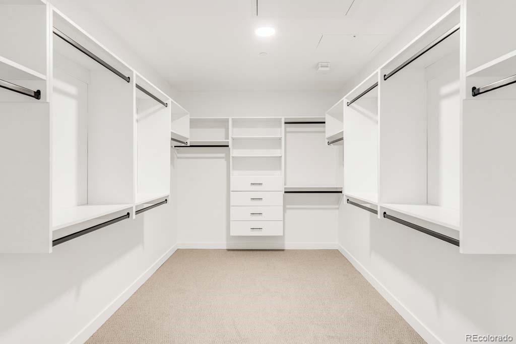 3520 Chestnut Place, Unit PH1201 Denver, CO 80216 - Photo 26 of 44 a view of walk in closet with empty racks